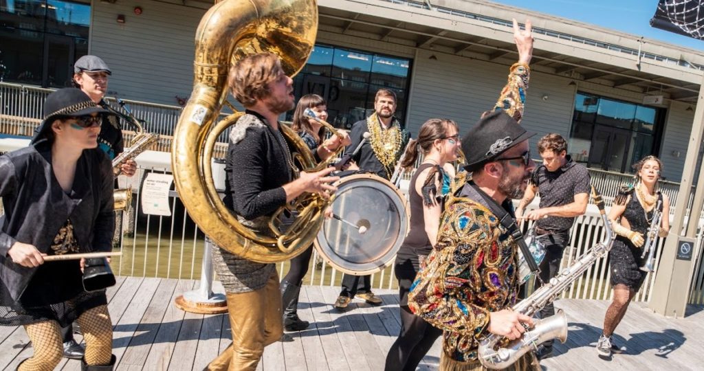 A brass band celebrates Pi Day at the Exploratorium.