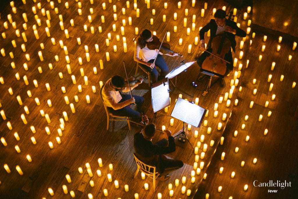 musicians play by candlelight