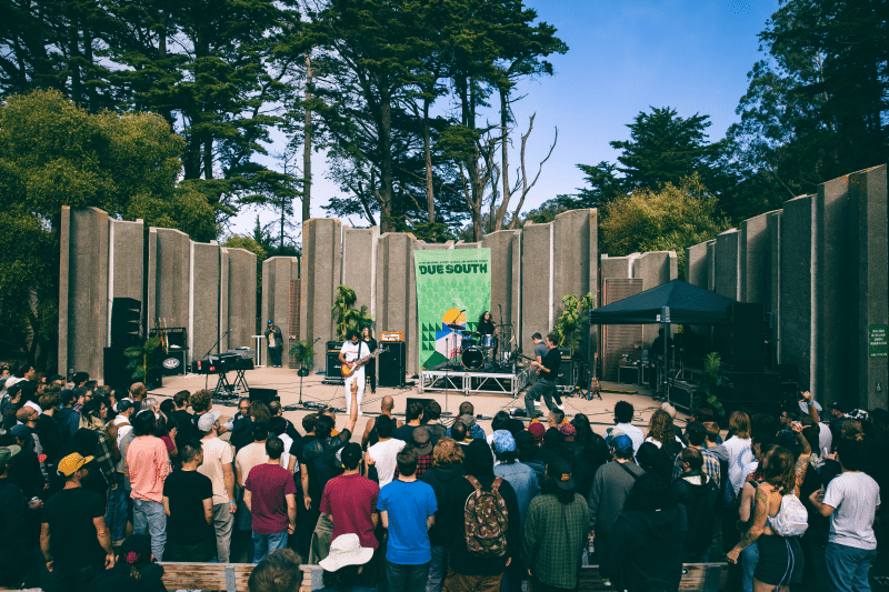 A crowd of people watches Deafhaven perform at Jerry Garcia Amphitheater
