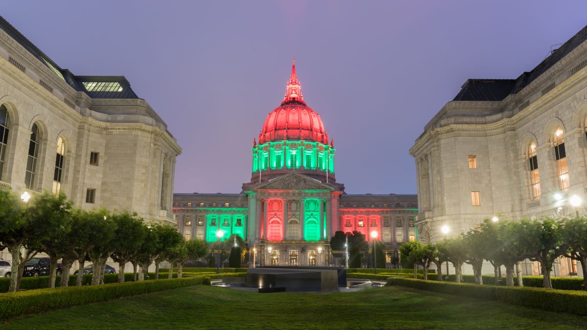 SF City Hall lit up in red, green, and black for Juneteenth.