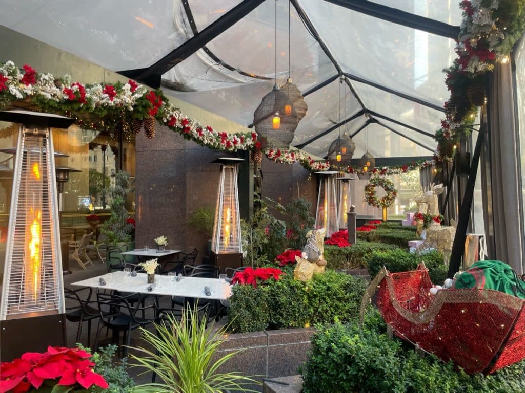A sheltered garden patio decorated for the holidays.