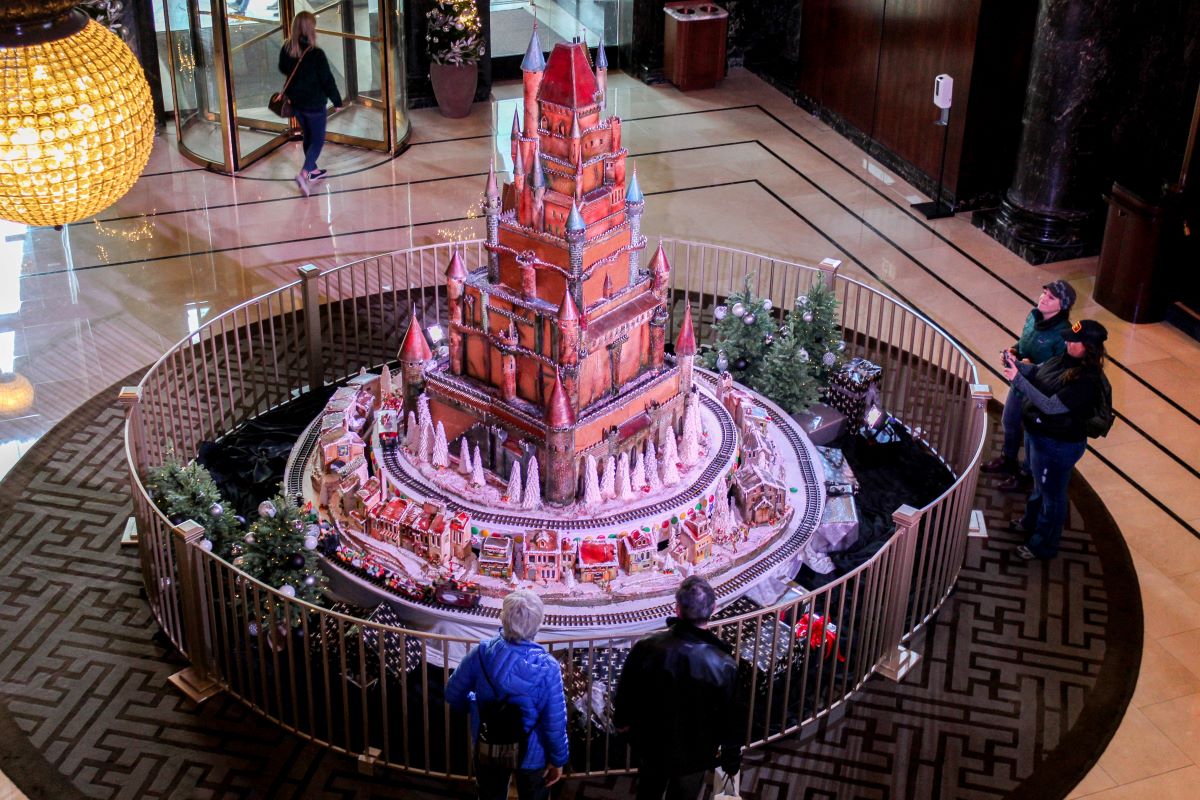 People gather around an enormous sugar castle display at the Westin St. Francis in San Francisco