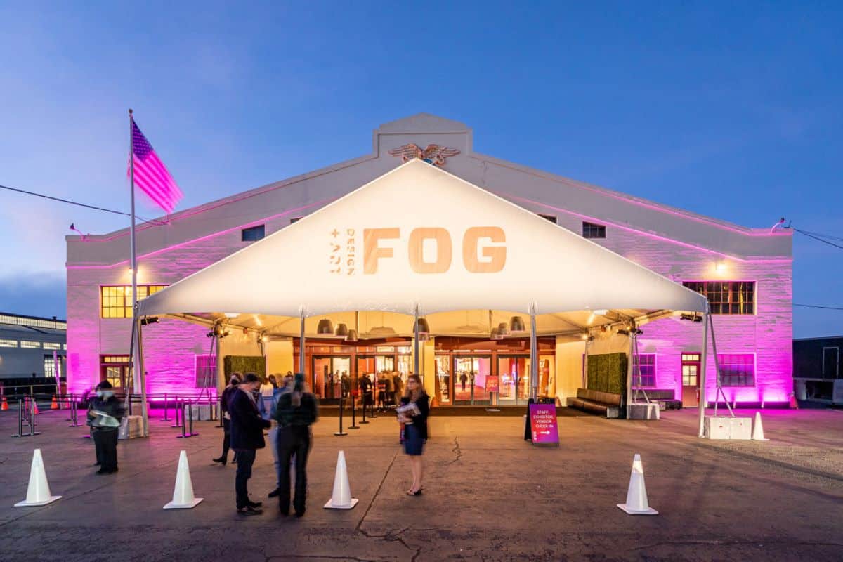 A luminous tent at the entrance to Fort mason Center with the words "Fog Design and Art."