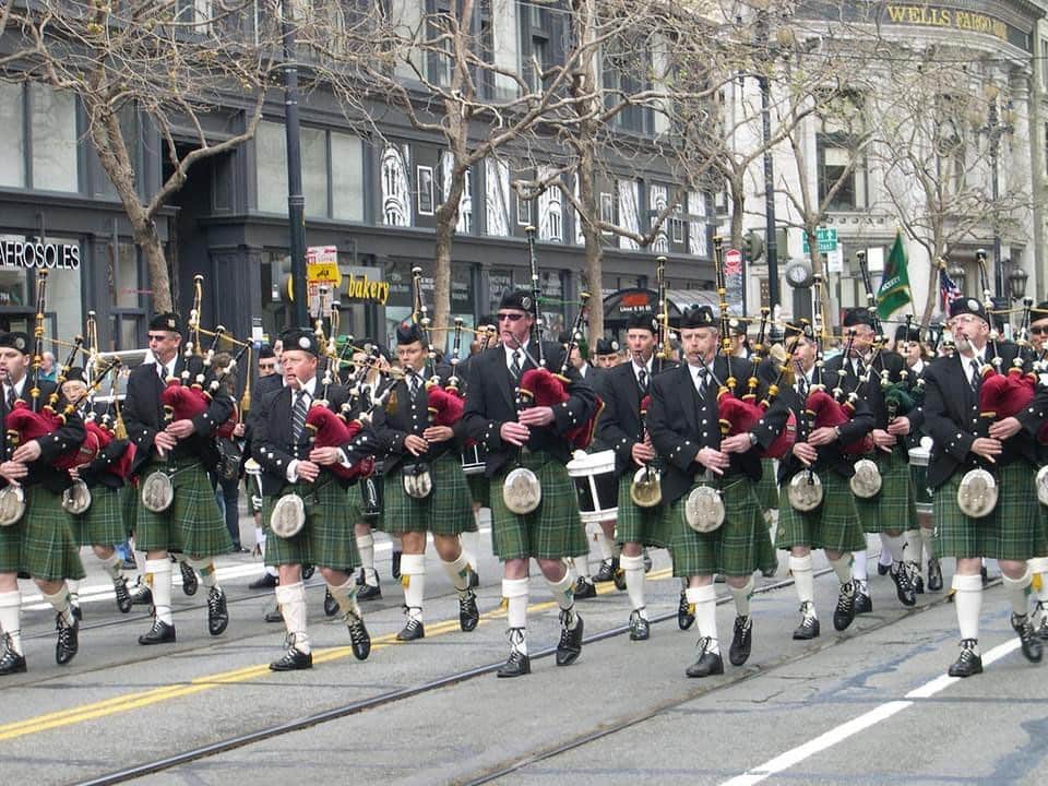 A group of performers plays bagpipes in the St. Patrick's Day Parade.