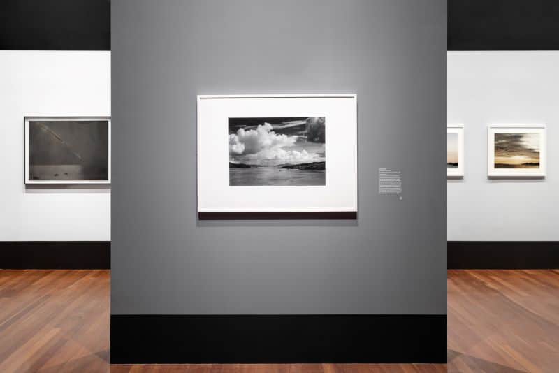 A gallery wall showing photography by Ansel Adams.