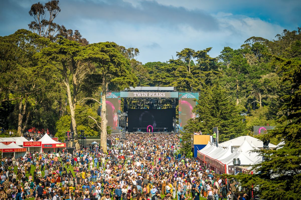 Outside Lands' Twin Peaks stage during the day with a large crowd watching in the foreground.