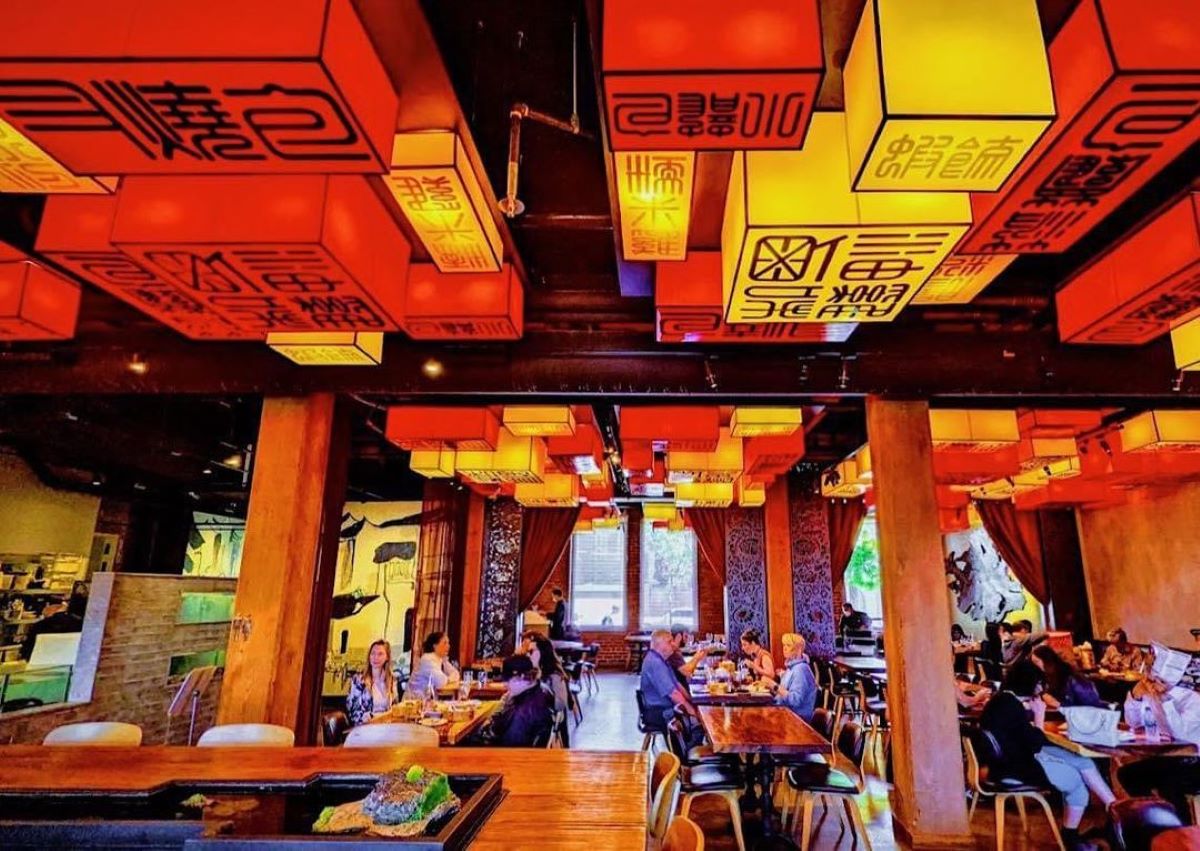 Interior of Palette Tea House with red and yellow box lanterns hanging from the ceiling.