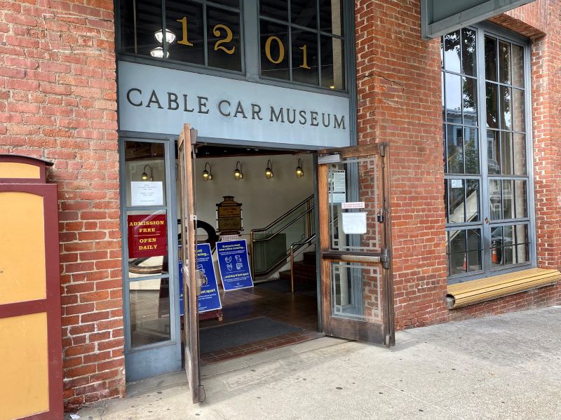 Exterior of SF Cable Car Museum in a red brick building.