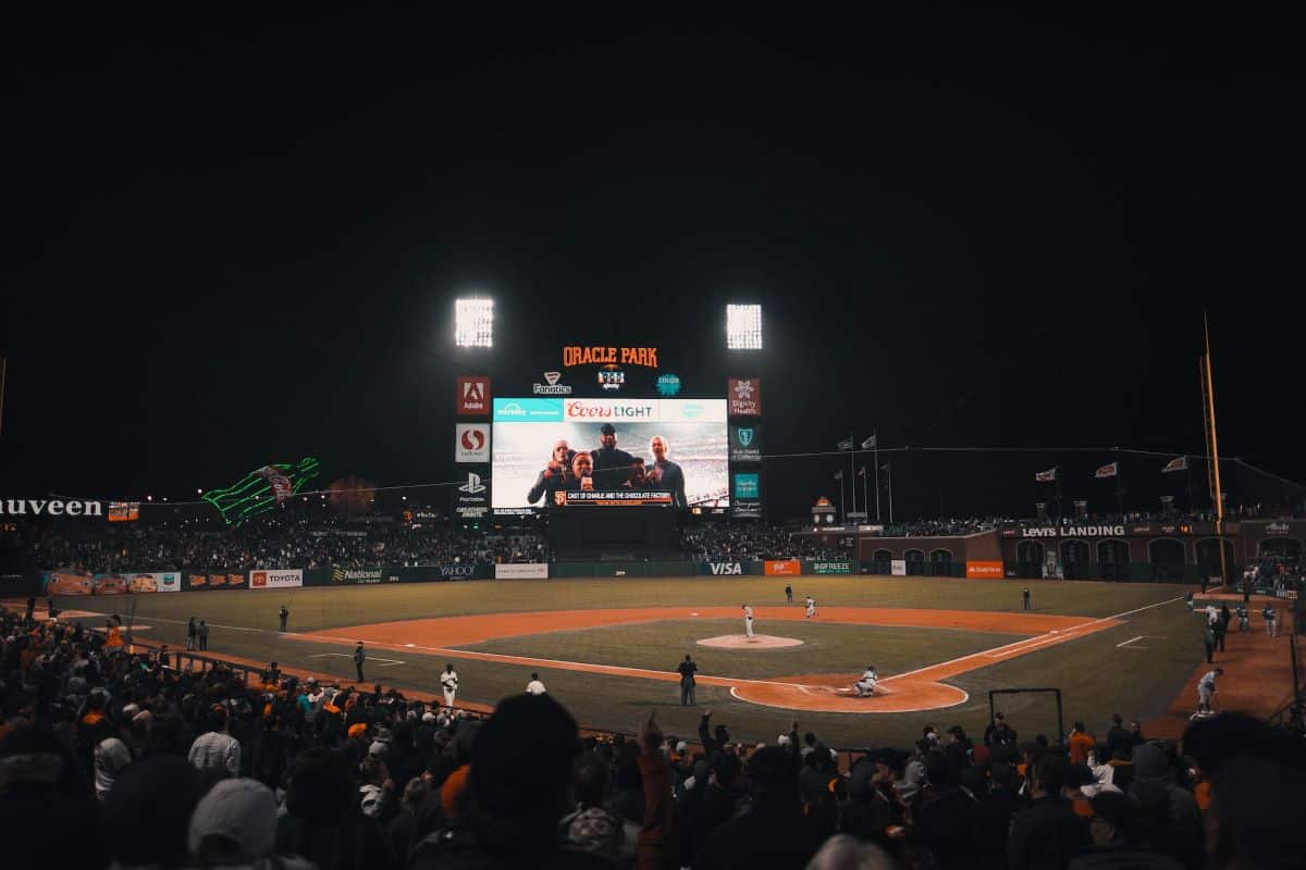 Giants play a game at Oracle Park at night.