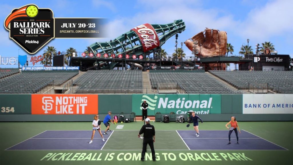 People play a game of pickleball on the field at Oracle Park
