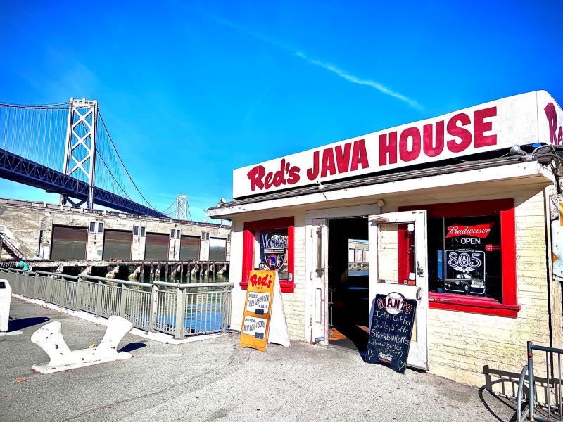 Red's Java House exterior with Bay Bridge in the background.