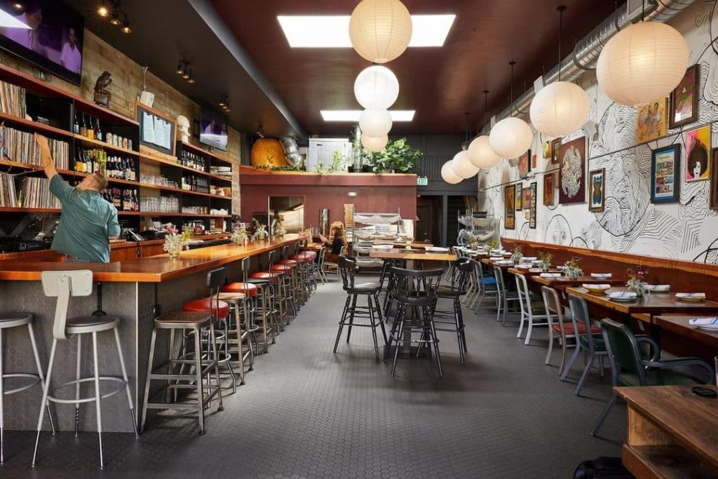 A spacious natural wine bar in SF with natural light and records.