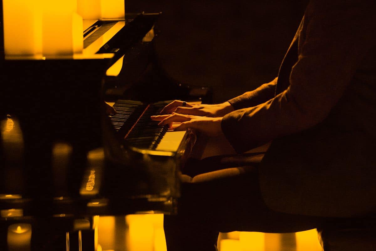 A close up of someone playing the piano.