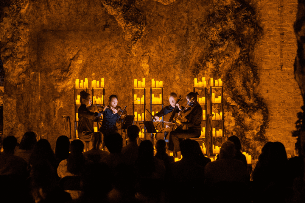 Musicians performing a Candlelight concert at the International Art Museum of America