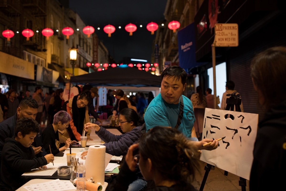 Past SF chinatown night market with caligraphy